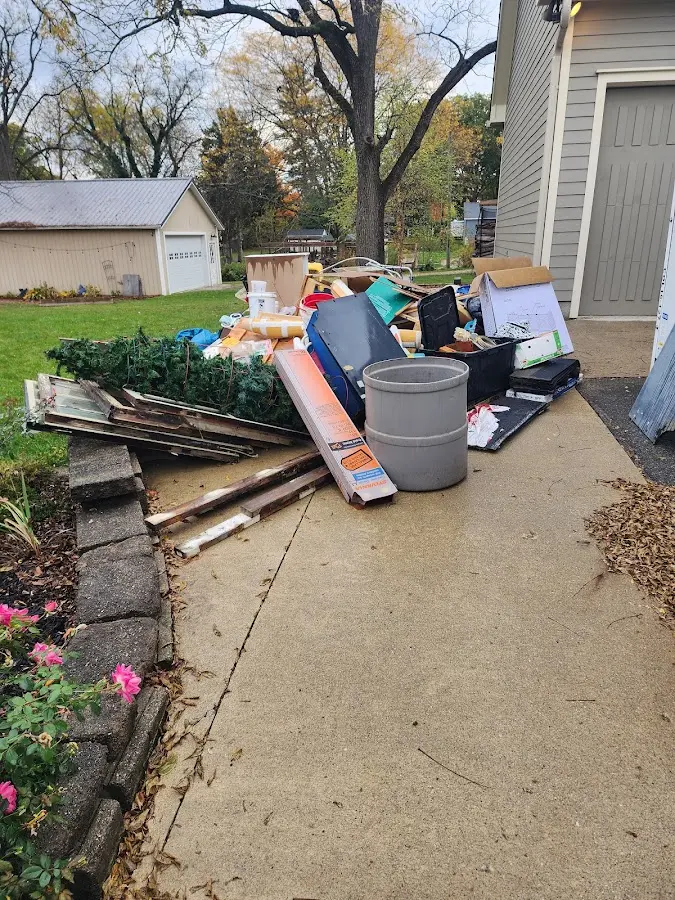 Dumpster being loaded with debris for Estate Cleanout Dumpster Rental in Georgetown